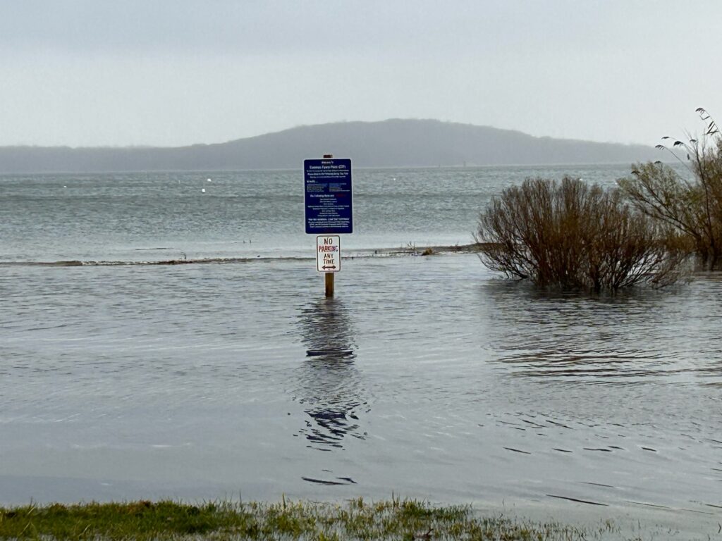 a sign in the middle of a body of water (MyCoast AI)