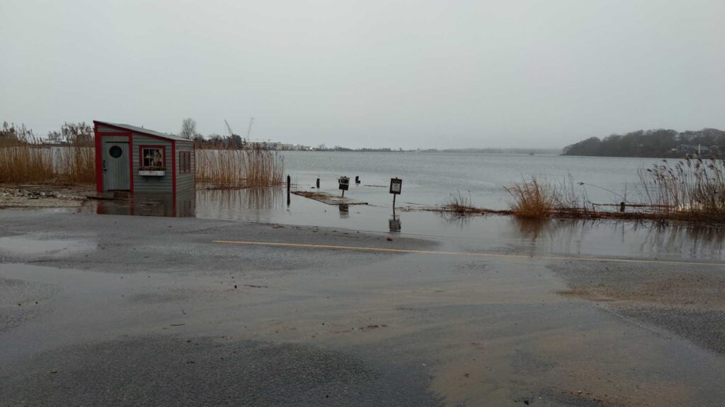 a small red building in a flooded area (MyCoast AI)
