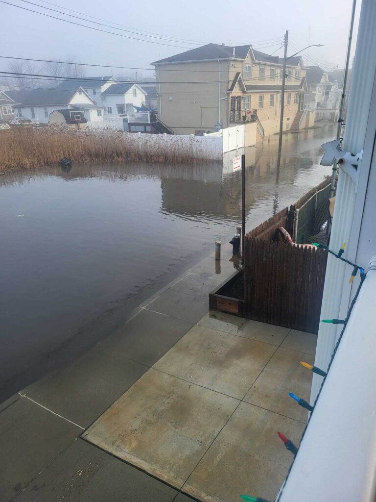 a flooded street with houses (MyCoast AI)