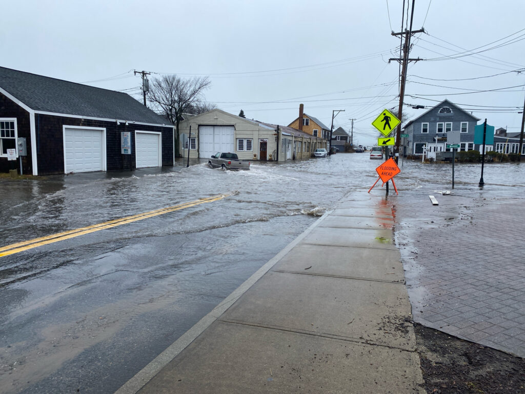 a road with a yellow sign on it (MyCoast AI)