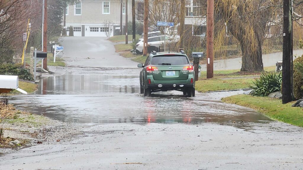 a car driving through a flooded street (MyCoast AI)