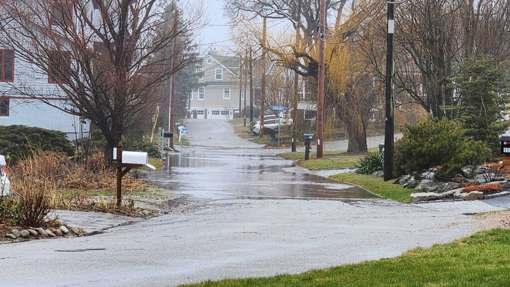 a flooded street with houses (MyCoast AI)