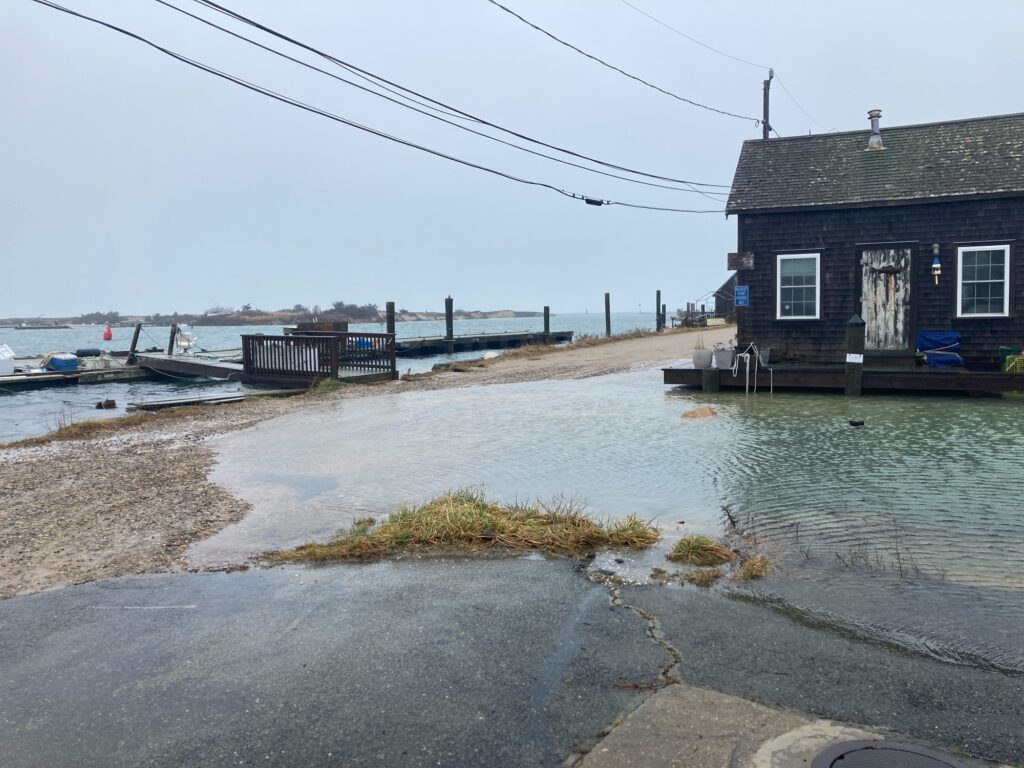 a body of water with a dock and a building by it (MyCoast AI)