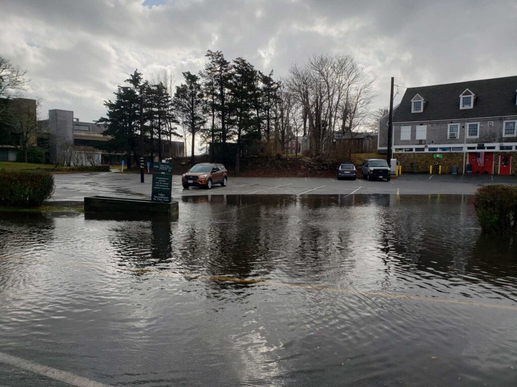 a flooded street with cars and buildings (MyCoast AI)