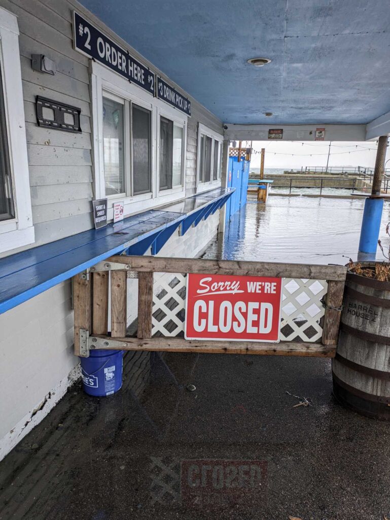 a sign on a dock (MyCoast AI)