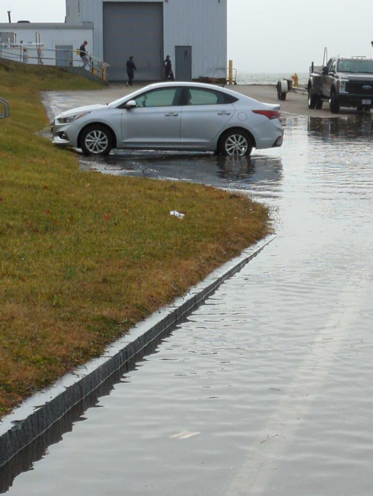 a car parked in a flooded parking lot (MyCoast AI)