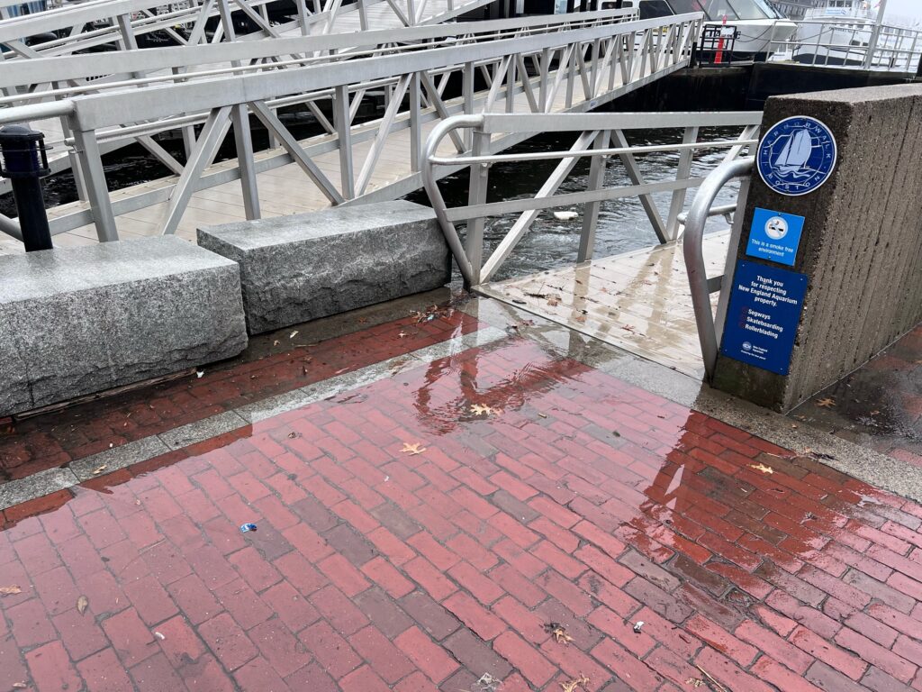a brick walkway with a metal railing (MyCoast AI)
