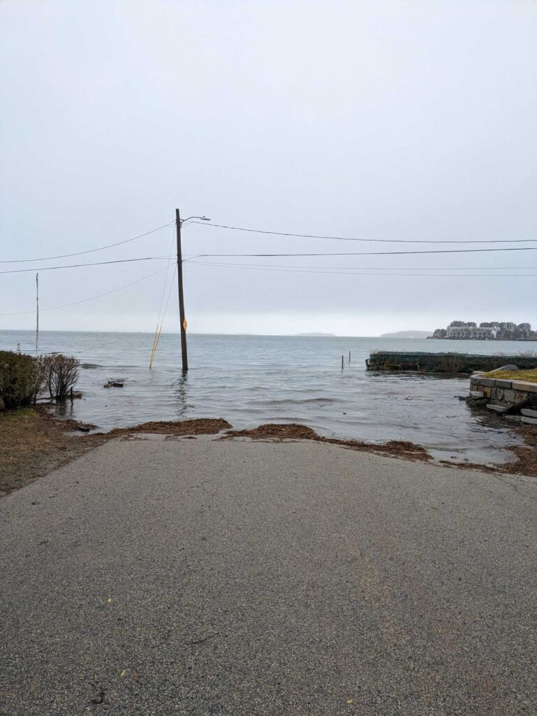 a road next to a body of water (MyCoast AI)