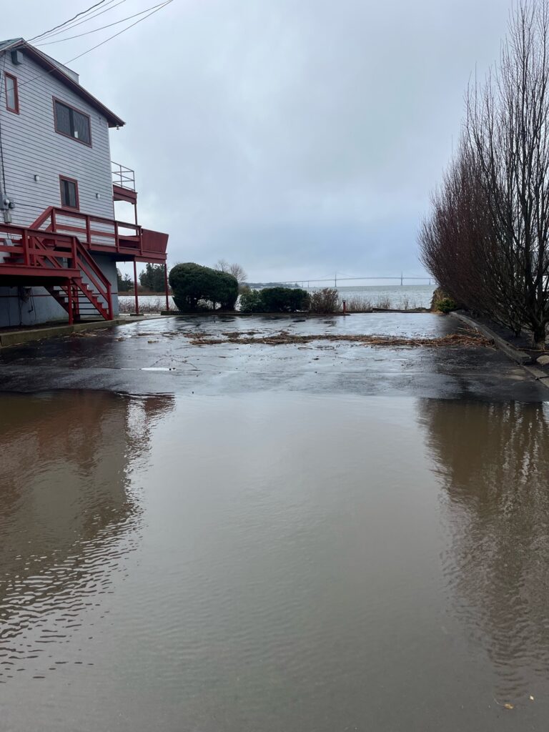 a flooded area with a building and a bridge (MyCoast AI)