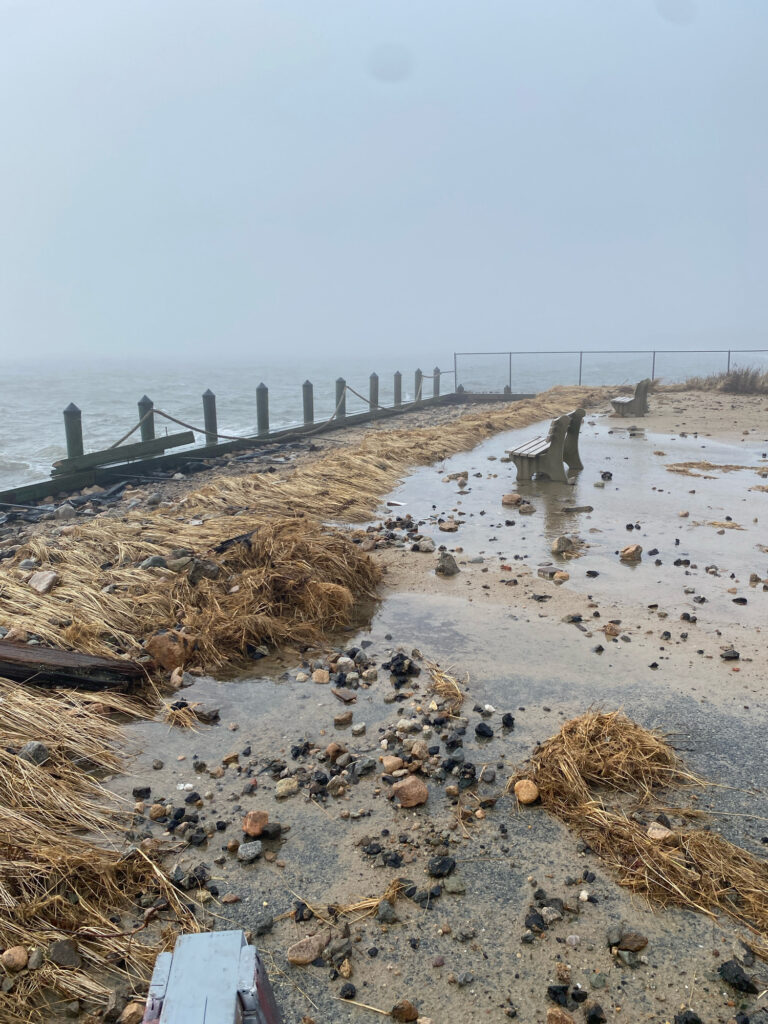 a beach with a pier and rocks (MyCoast AI)