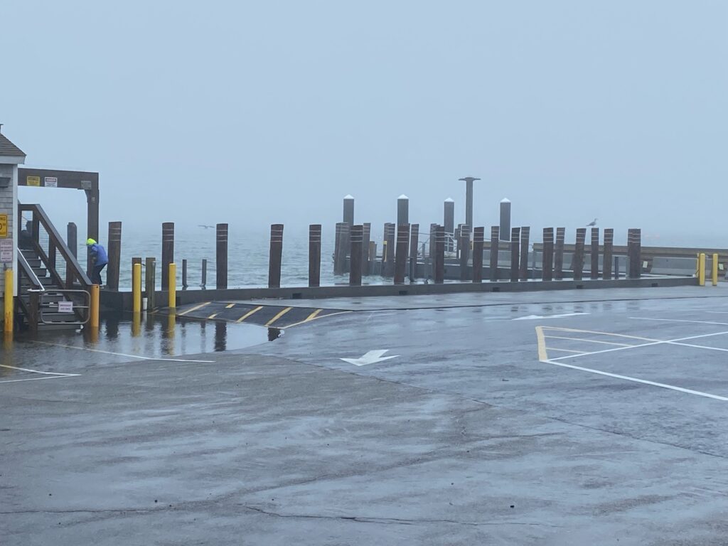 a large concrete structure with a row of pillars on the side (MyCoast AI)