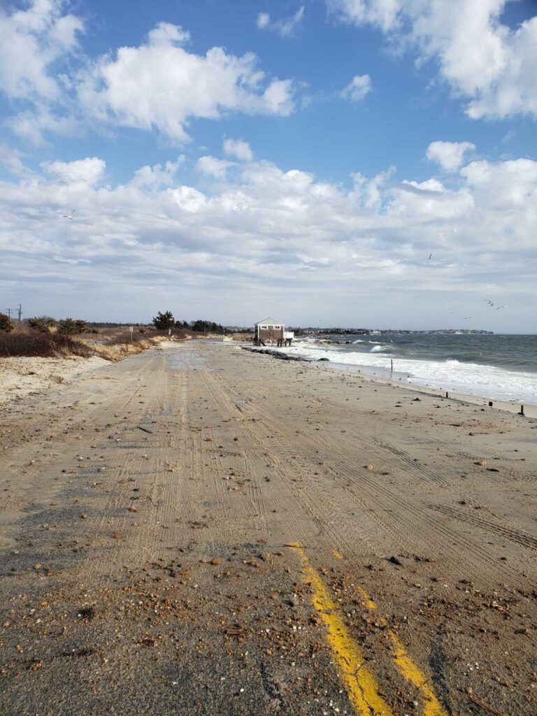 a sandy beach with a truck (MyCoast AI)
