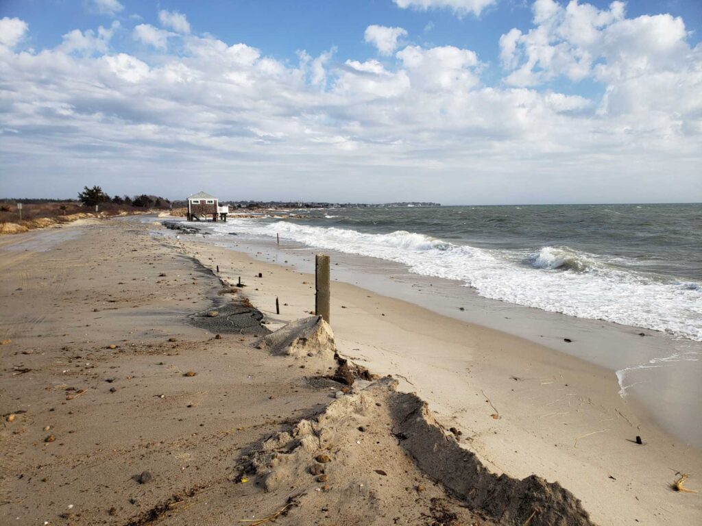 a sandy beach with waves crashing on it (MyCoast AI)