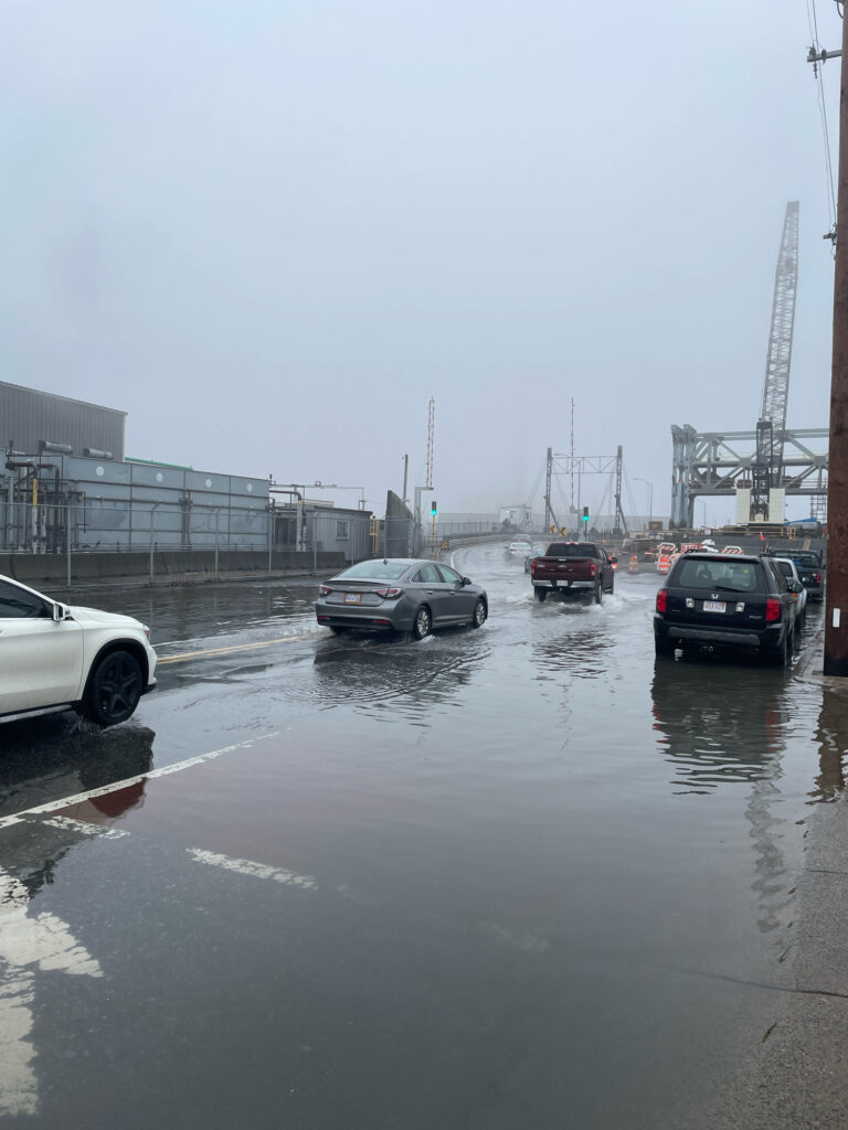 a group of cars on a wet road (MyCoast AI)