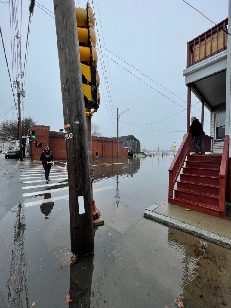 a person walking on a wet street (MyCoast AI)