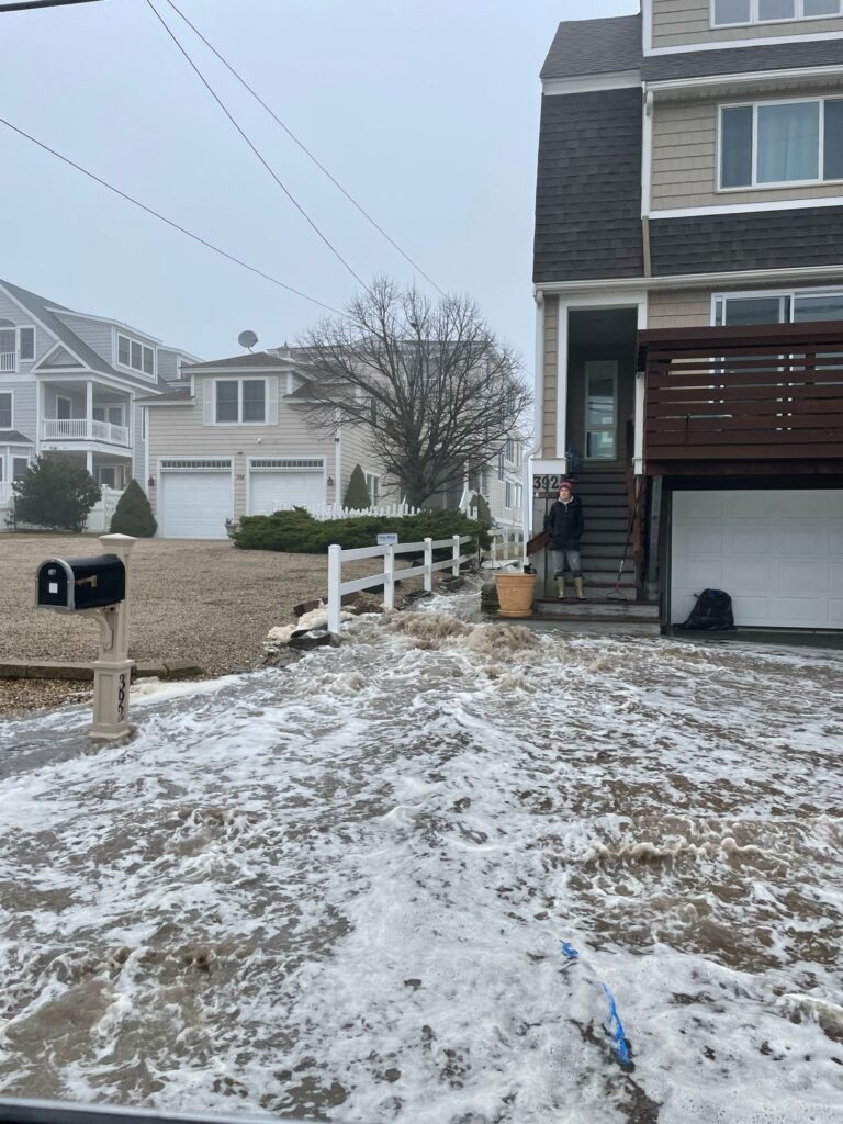 a person sitting on a porch in the snow (MyCoast AI)