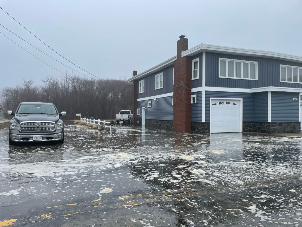 a car parked in front of a house (MyCoast AI)