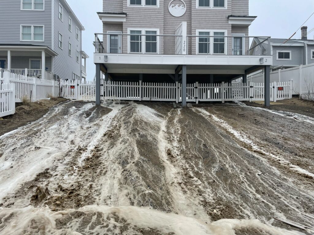 a pile of dirt in front of a building (MyCoast AI)