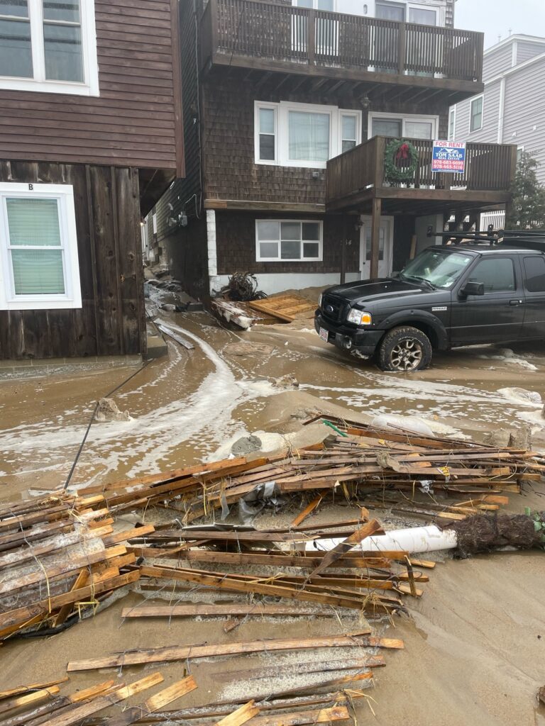 a truck parked in front of a building that has been flooded (MyCoast AI)