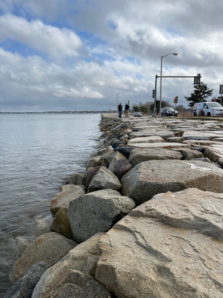 a group of people walking on a rocky beach (MyCoast AI)