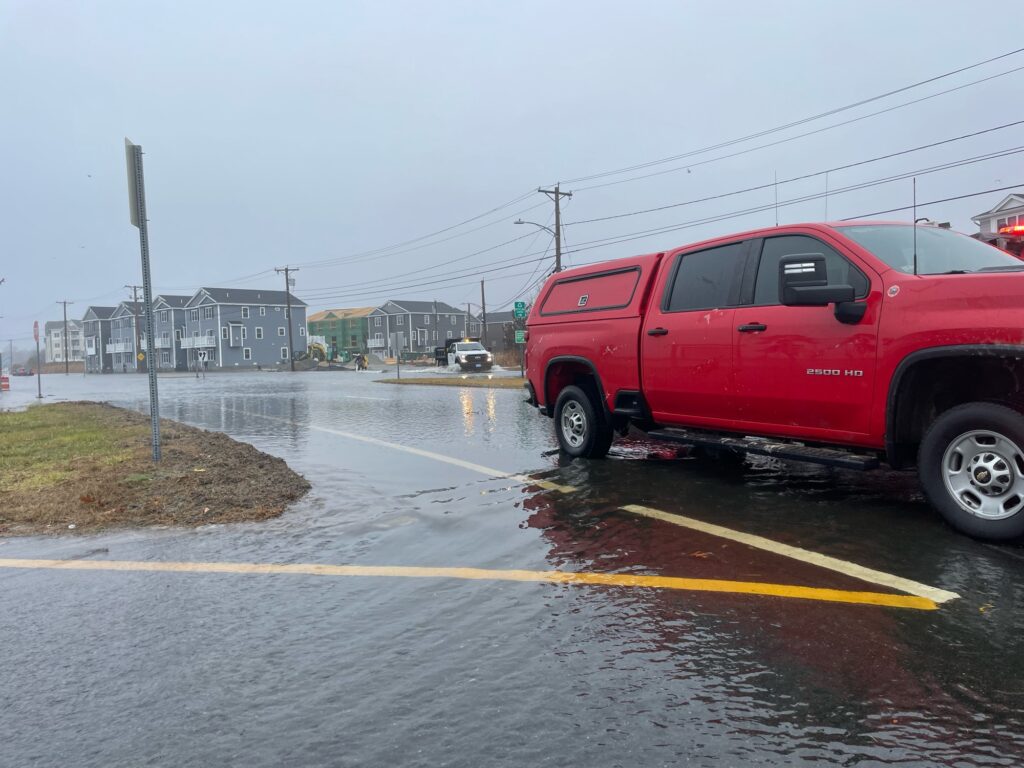 a red truck on a wet road (MyCoast AI)