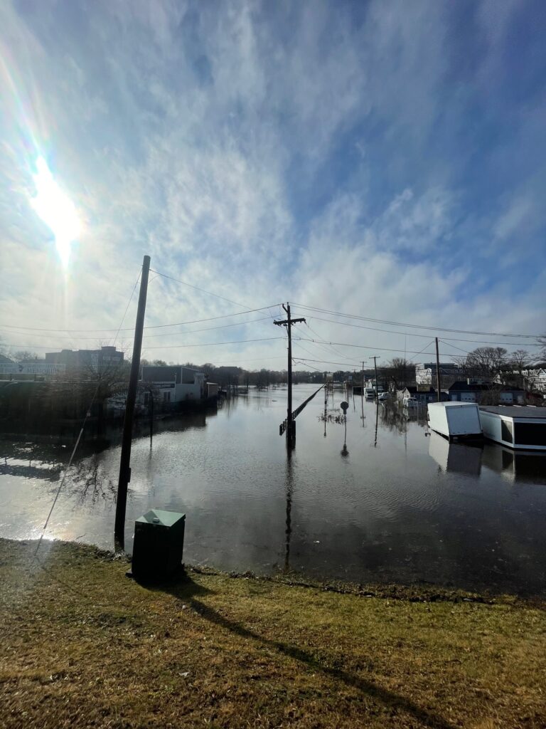 a body of water with boats and buildings along it (MyCoast AI)