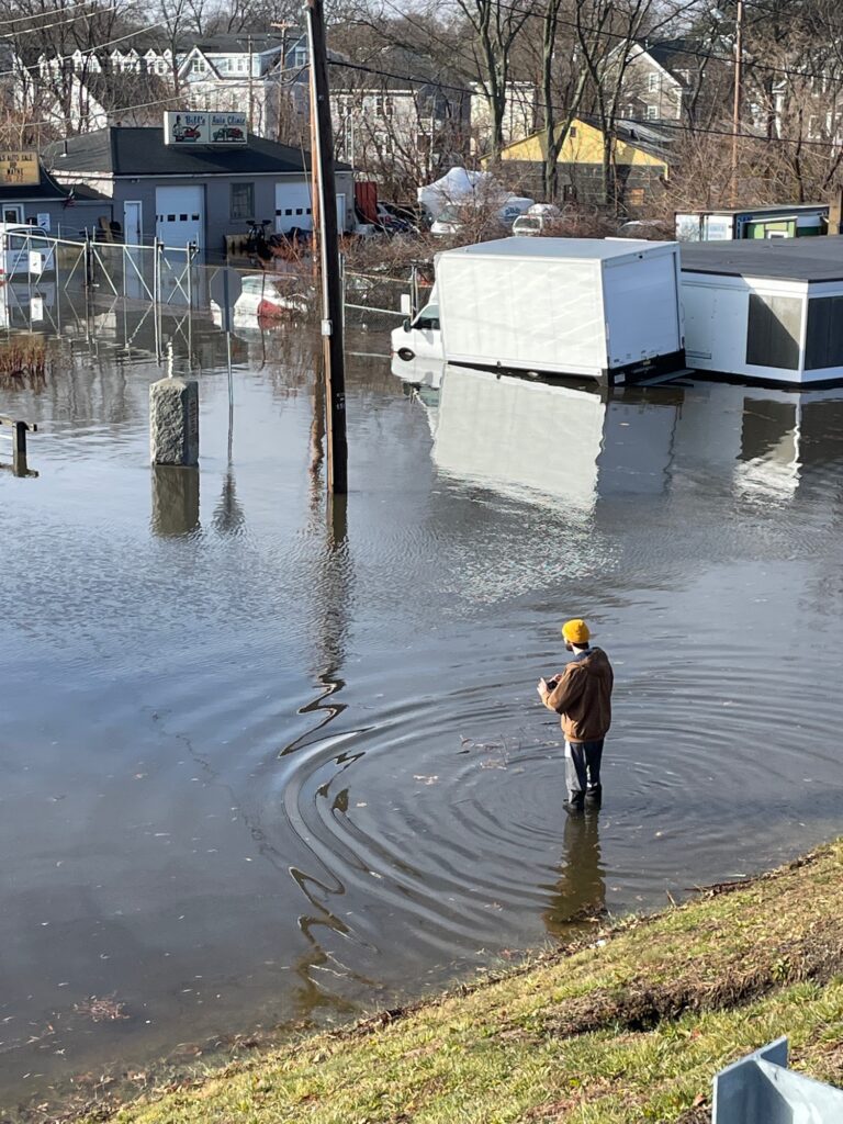 a person standing in a flooded area (MyCoast AI)