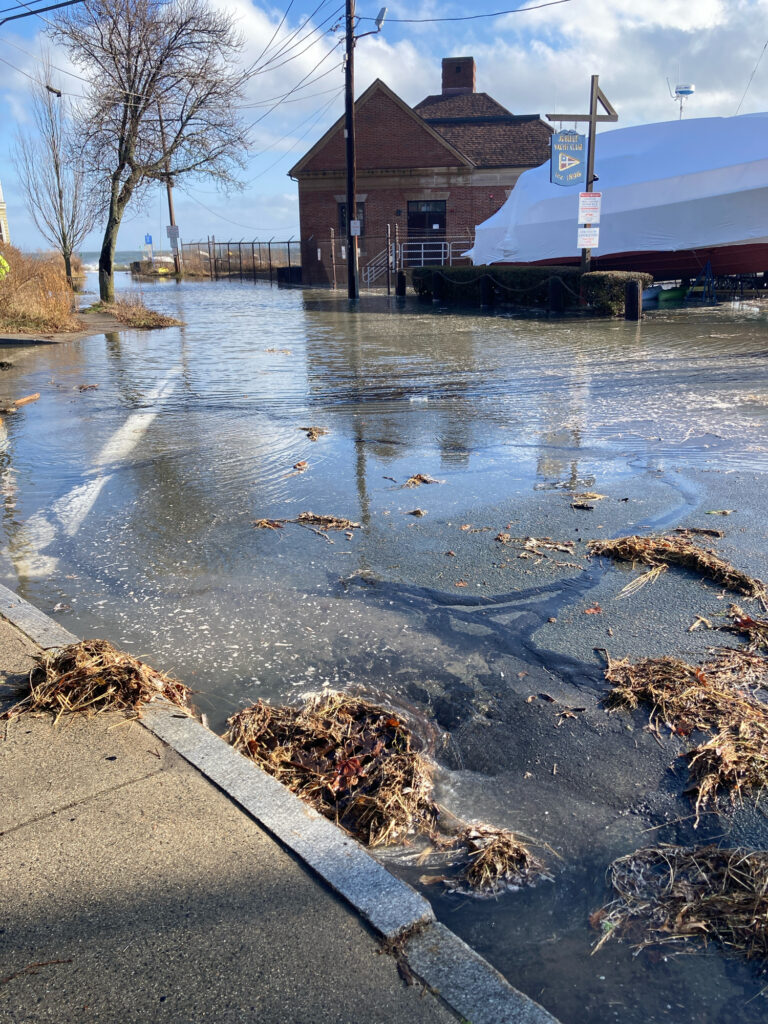 a flooded street with a building in the background (MyCoast AI)