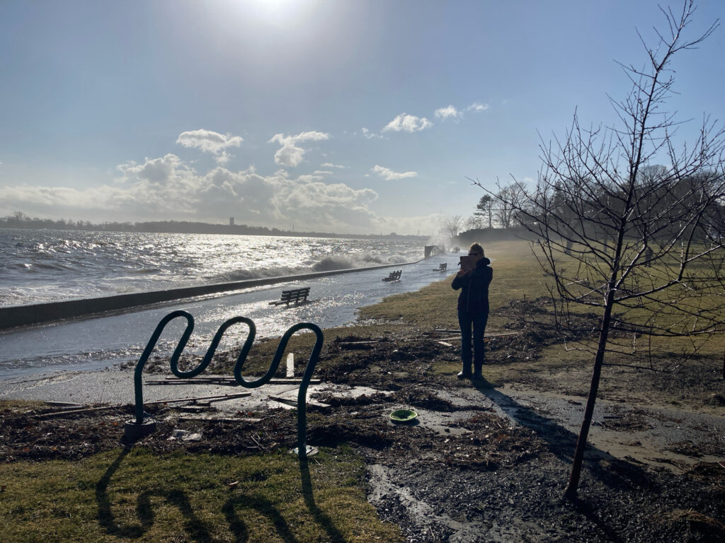 a person standing next to a bench (MyCoast AI)