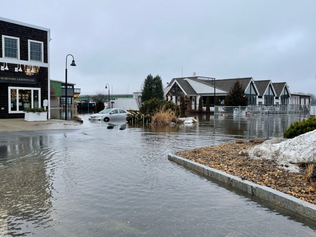 a flooded street with houses on either side of it (MyCoast AI)