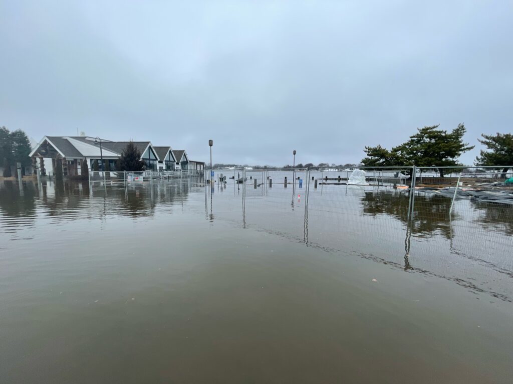 a flooded area with houses in the background (MyCoast AI)