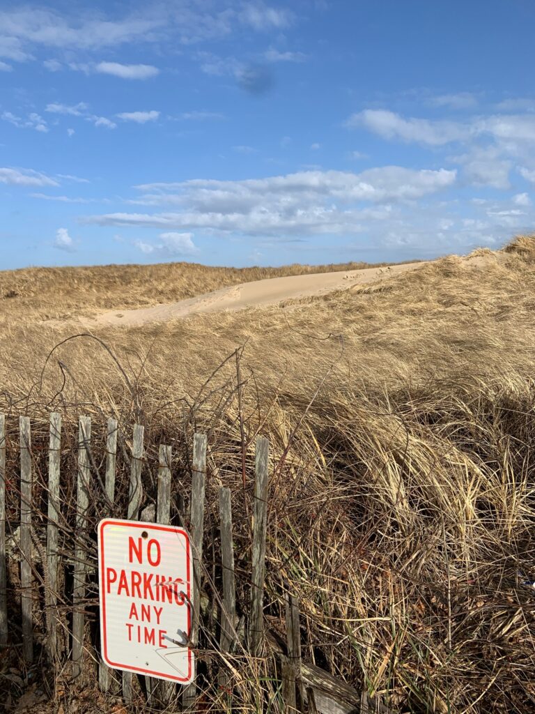 a sign on a fence (MyCoast AI)