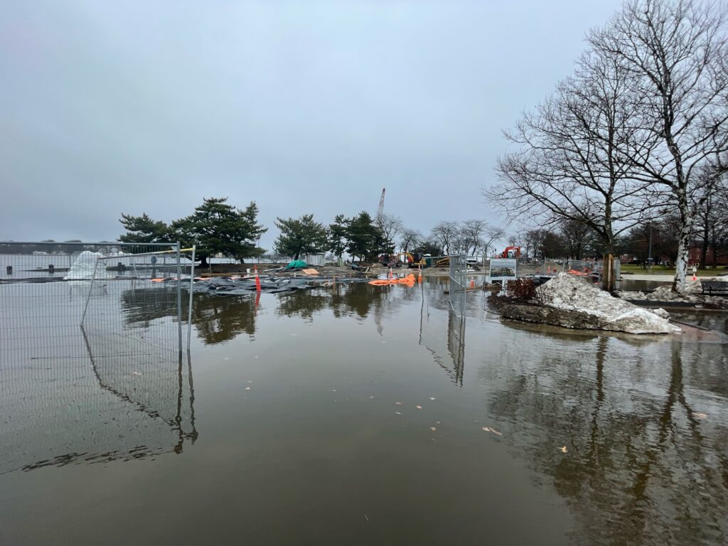 a body of water with boats in it and trees around it (MyCoast AI)