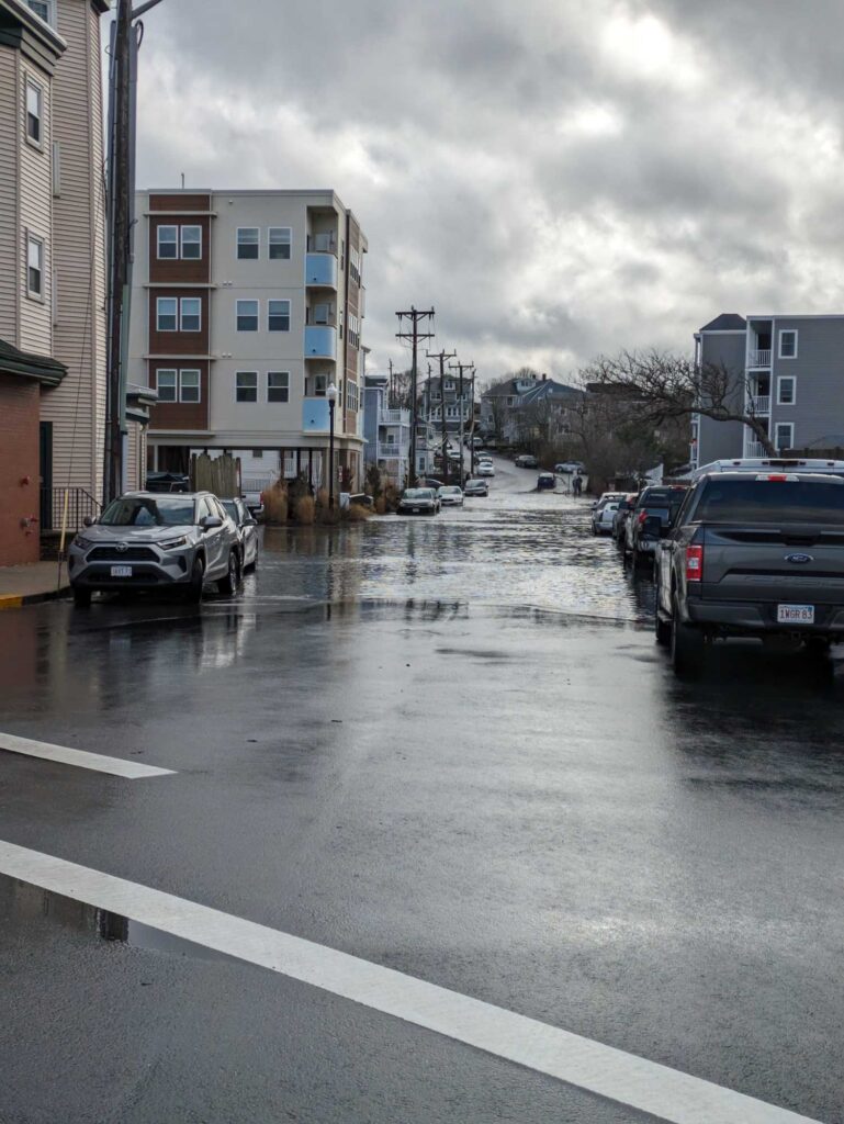 a street with cars and buildings on the side (MyCoast AI)