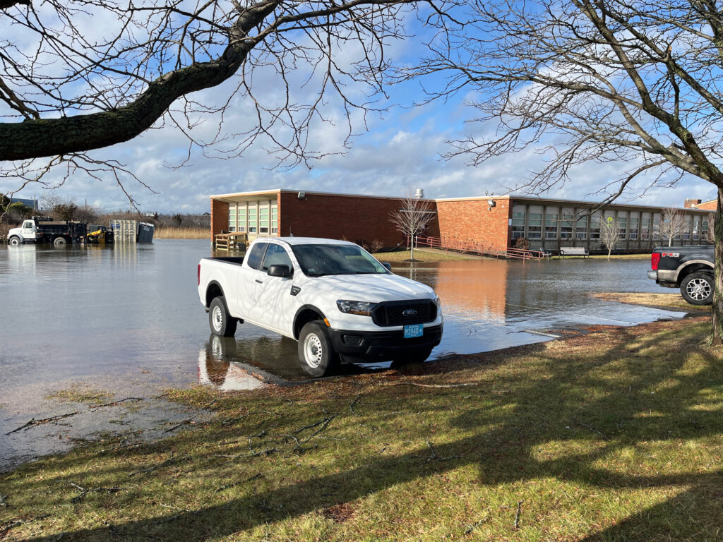 a white truck parked in a flooded lot (MyCoast AI)