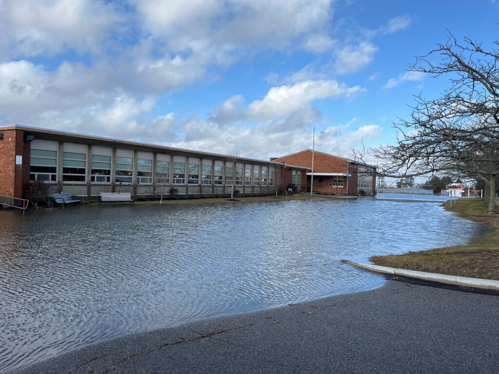 a building next to a body of water (MyCoast AI)