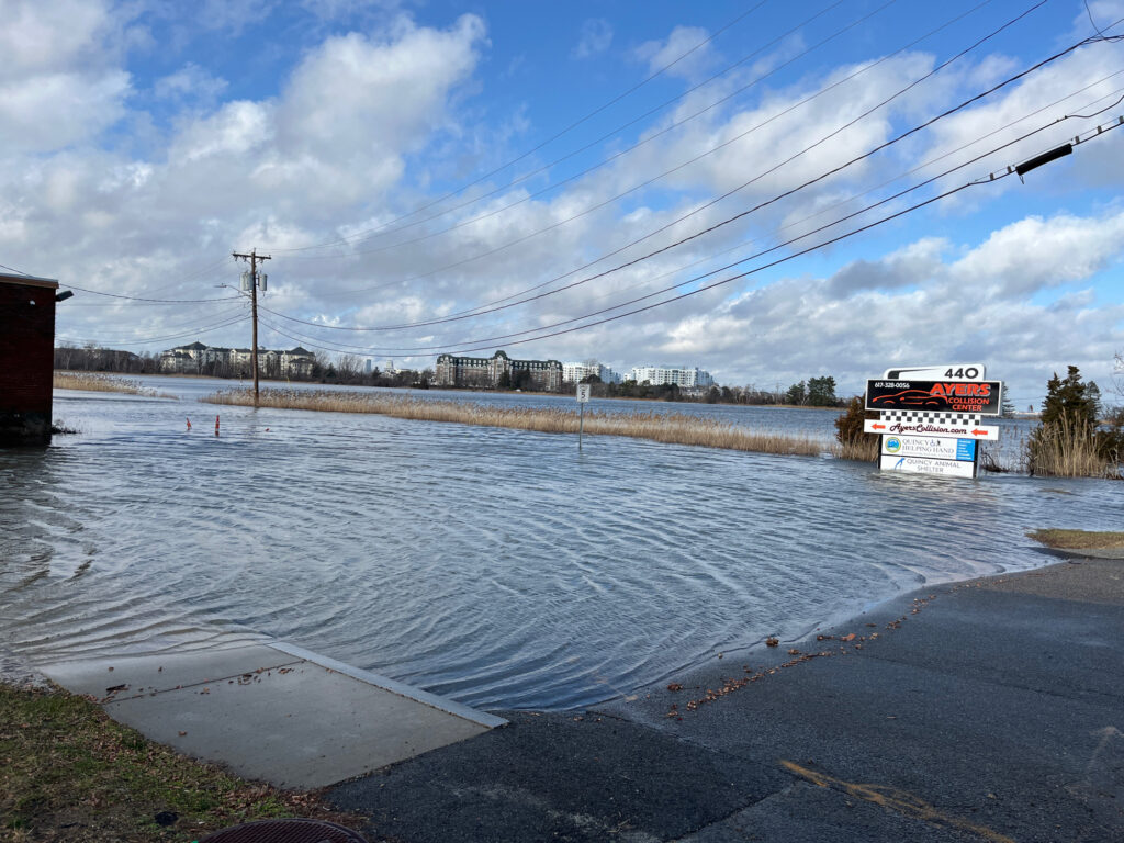 a bus driving through a flooded street (MyCoast AI)
