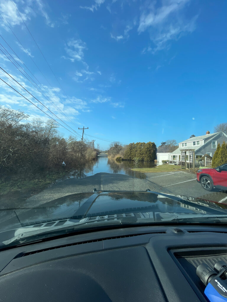 a view of a river and houses from a car window (MyCoast AI)