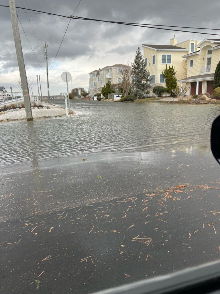 a flooded street with houses (MyCoast AI)