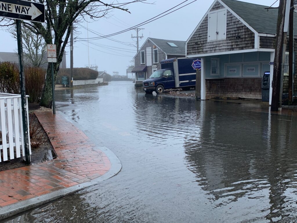 a flooded street with a van (MyCoast AI)