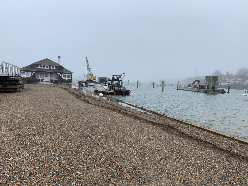 a beach with a boat and a house on the shore (MyCoast AI)