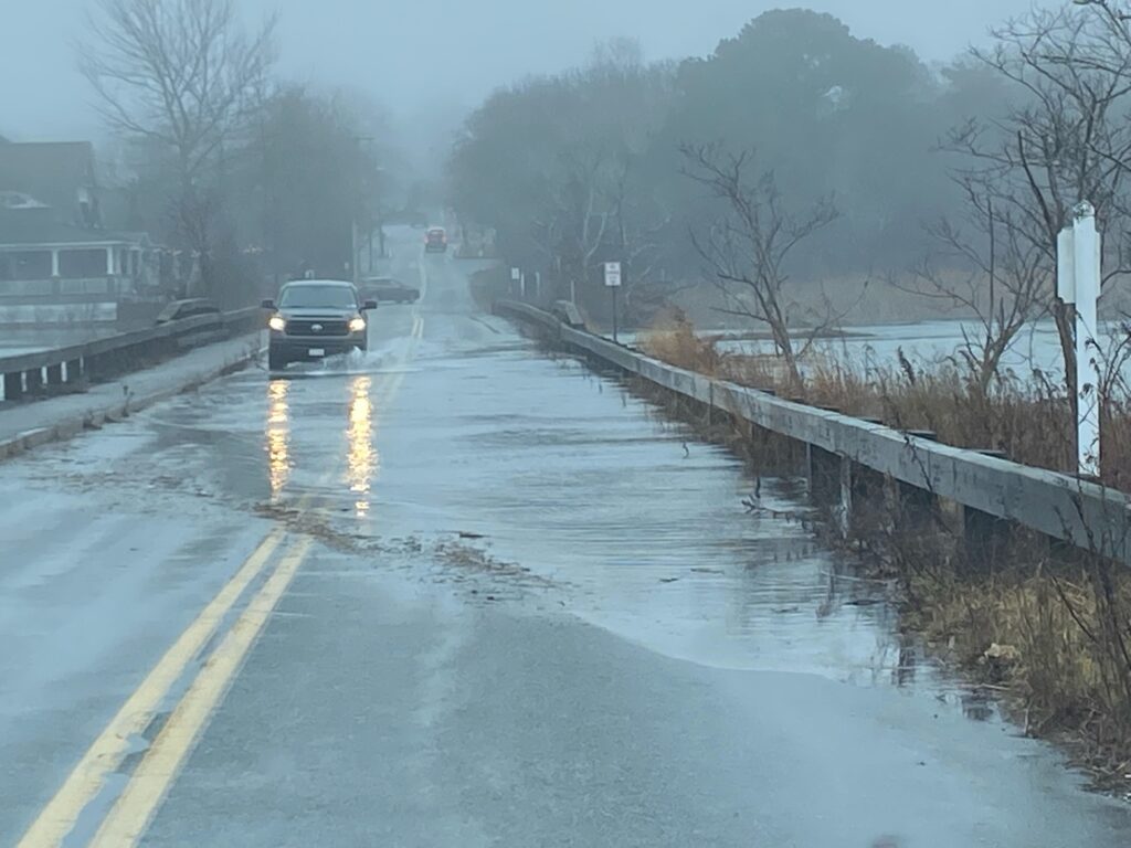 a car driving on a wet road (MyCoast AI)