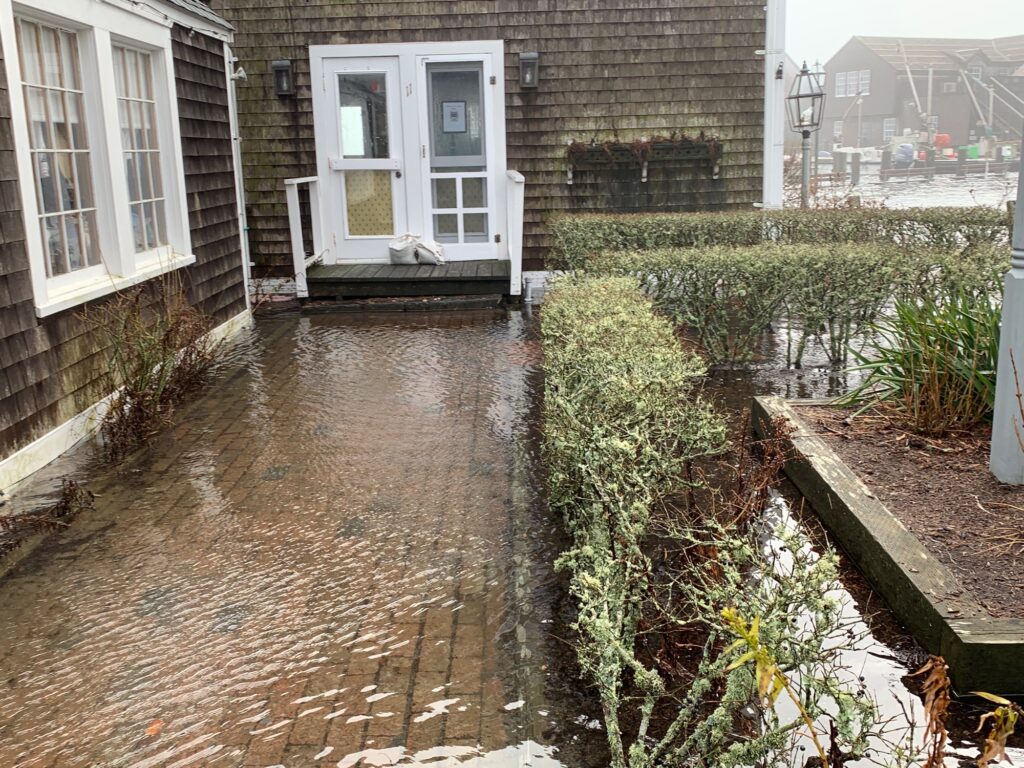 a flooded street with a house (MyCoast AI)