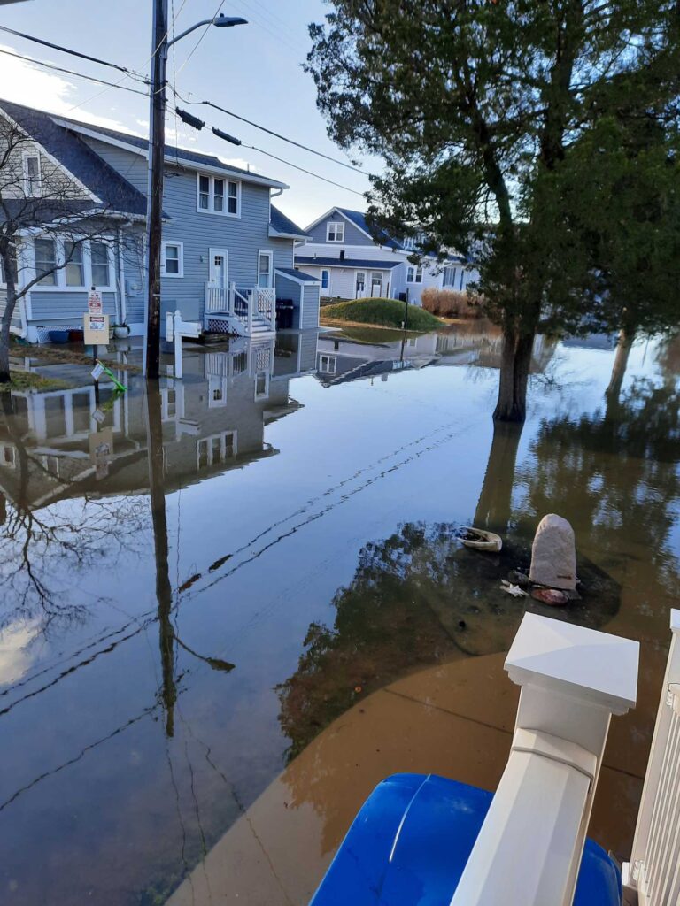 a flooded street with houses (MyCoast AI)