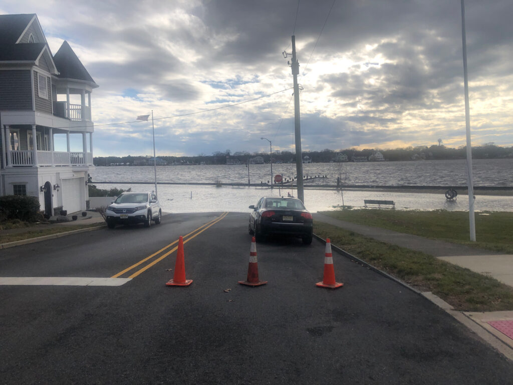 cars on a road by a body of water (MyCoast AI)