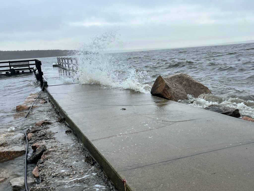 a large wave crashing into a beach (MyCoast AI)