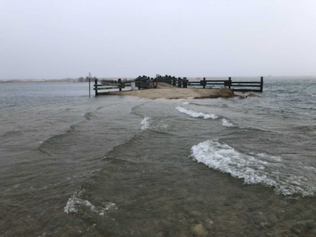 a beach with waves crashing on it (MyCoast AI)