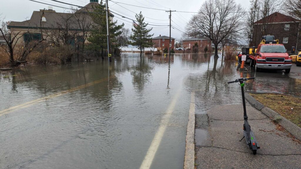 a flooded street with a truck and a fire truck (MyCoast AI)