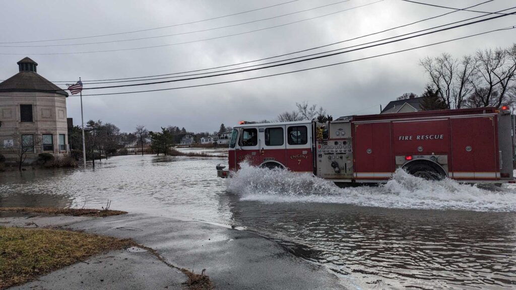 a firetruck driving through a flooded street (MyCoast AI)