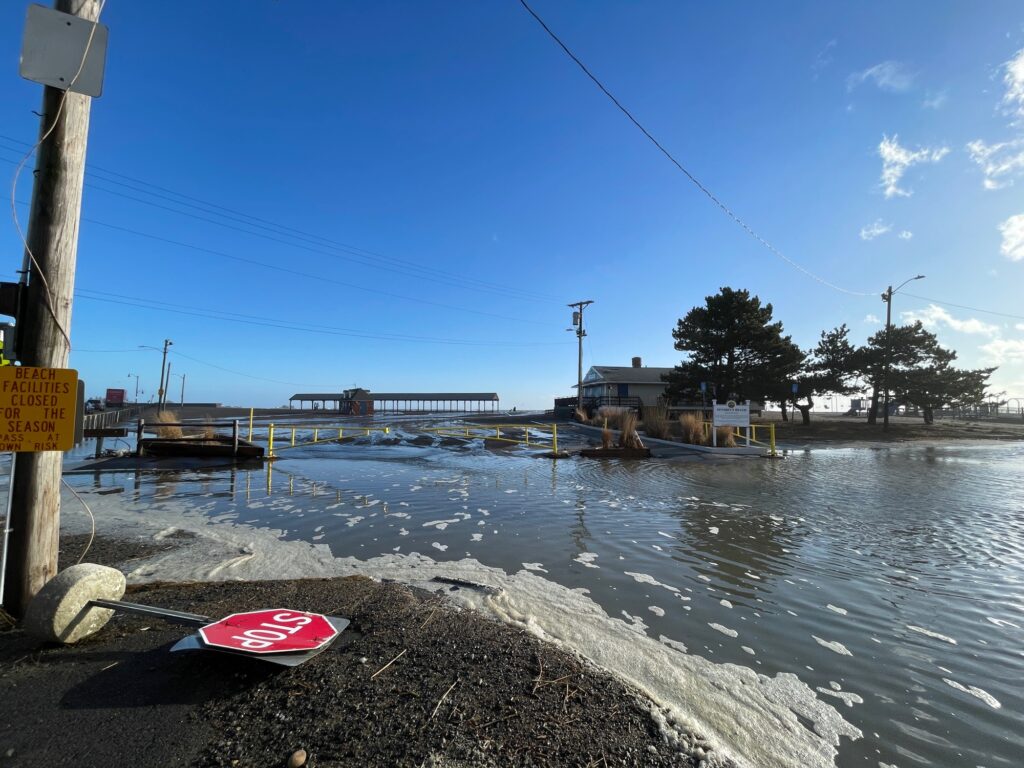 a body of water with a sign on it (MyCoast AI)